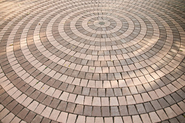 Concrete paving blocks, sorted into circle.