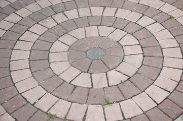Concrete paving blocks, sorted into circle.