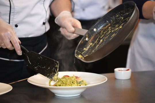 Chef preparing pasta closeup