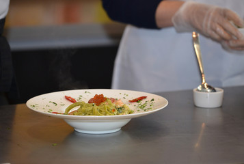 Chef preparing pasta closeup