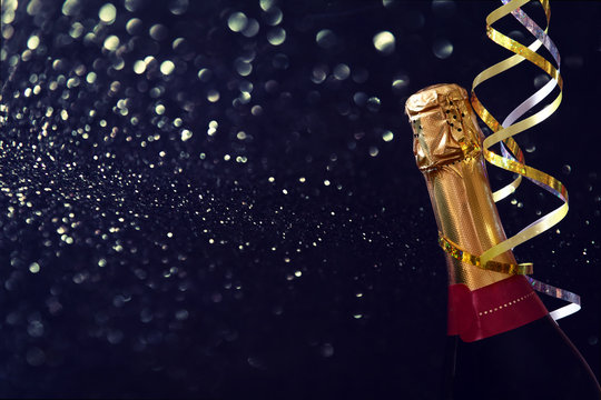 Abstract image of champagne bottle and festive lights