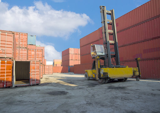 forklift handling the container box in logistic zone