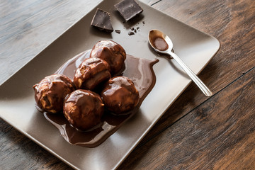 Profiteroles with chocolate cream.