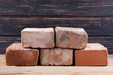 Old brick on wood desk