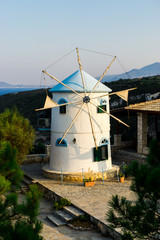 Fototapeta na wymiar Old windmill at the sea