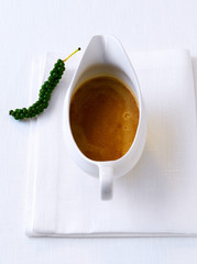 Brown pepper sauce in a sauce boat