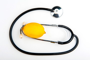 Stethoscope and lemon on a white background