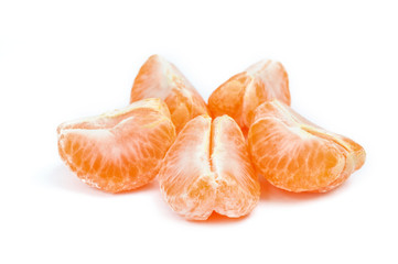 Pieces of orange tangerine or mandarin  isolated over white back
