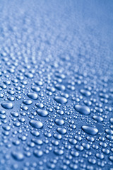 Water drops on blue background  