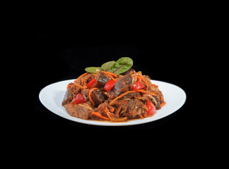 salad with aubergine and red pepper on white plate isolated on b