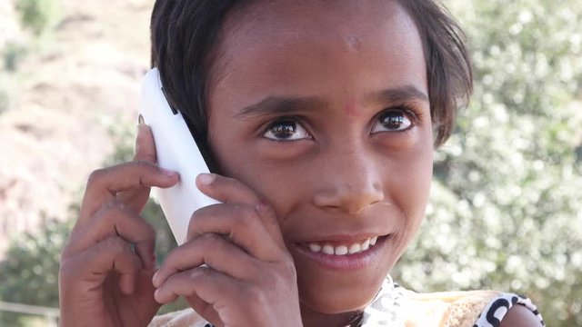 Lovely little Indian talking on her cell phone mobile 