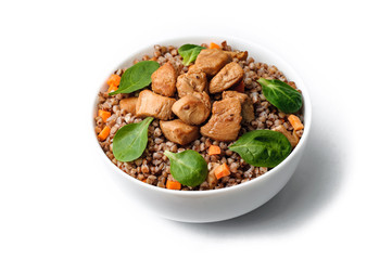 buckwheat with meat and vegetables on white background