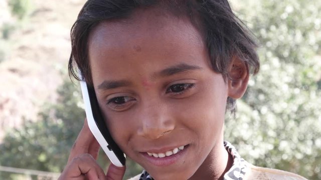 Lovely little Indian talking on her cell phone mobile 