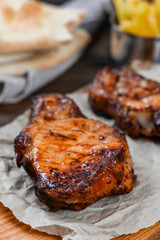 Two piece of meat cooked on the grill
