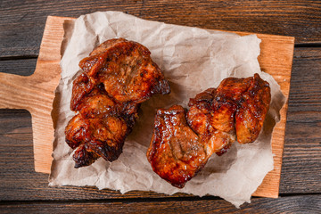 Two piece of meat cooked on the grill