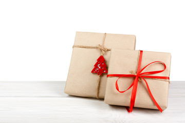 Christmas holiday gift boxes in green paper isolated on white