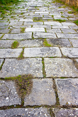 Typical old Tuscany paving made with carved stone blocks