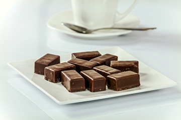 Appetizing chocolates with coffee