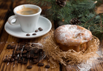 Breakfast with pastries and coffee in the rustic style on old boards