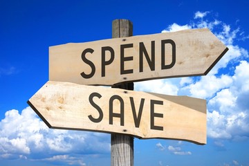 Spend, save - wooden signpost