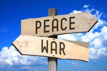 Peace, war - wooden signpost