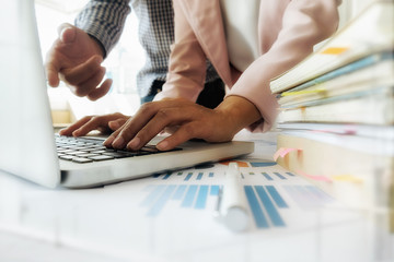 Business concept. Business people discussing the charts and graphs showing the results of their...
