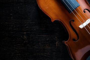 Violin on wooden dark background