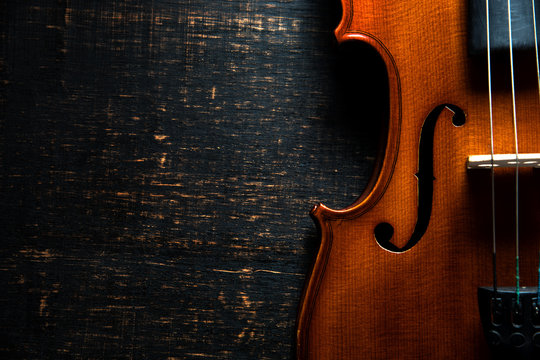 Violin on wooden dark background