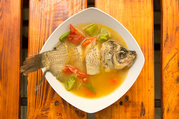 Carp gourami fish spicy soup with chili and herbs