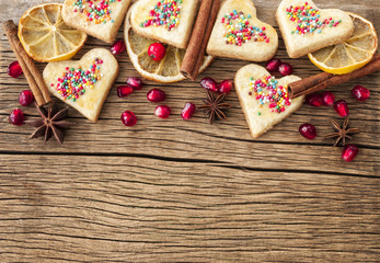 homemade cookies in the form of hearts on wooden background