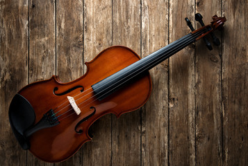 Plakat Violin on wooden background