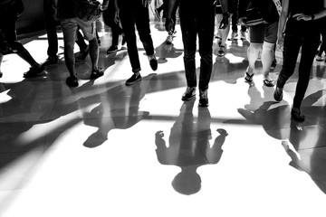 People walking and shadow on the floor