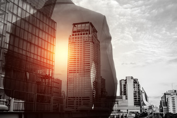 Double exposure of businessman and cityscape
