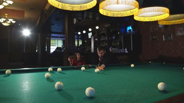 handsome serious man playing pool
