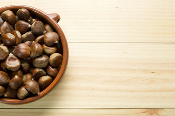 Chestnuts in an earthenware bowl.