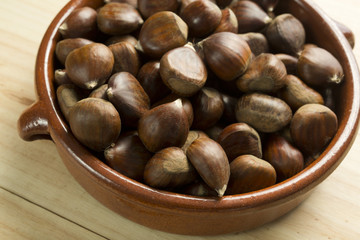 Chestnuts in an earthenware bowl.