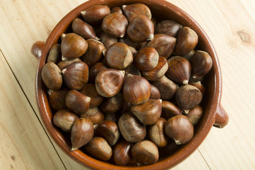 Chestnuts in an earthenware bowl.