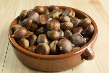 Chestnuts in an earthenware bowl.