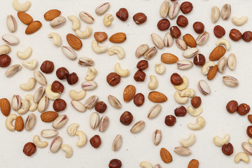 Composition of nuts pattern - mix hazelnuts, cashews, almonds, pistachios.