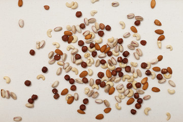 Composition of nuts pattern - mix hazelnuts, cashews, almonds, pistachios.
