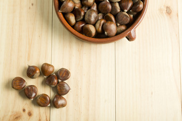 Chestnuts in an earthenware bowl.