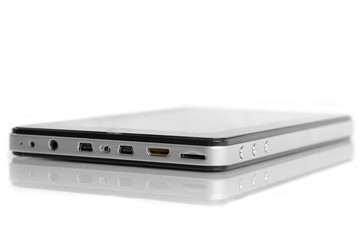 Tablet device black with silver metal side close up port
