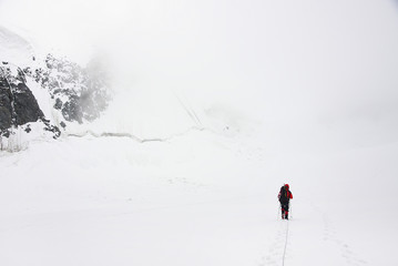 Alpinist traversing Mensu Glacier in Altai Mountains, Russian Federation