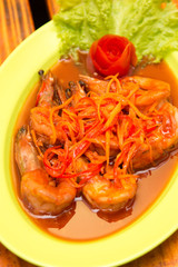 Shrimp prawn in sweet and sour sauce with carrot slices