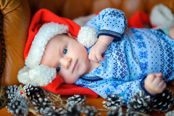 newborn baby in Santa Claus's cap