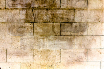stone limestone block wall of old building.