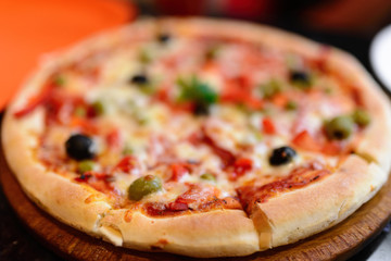 Pizza with ham, pepper and olives