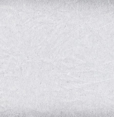 Recycled, grainy, creased off white paper texture background  - 129709260