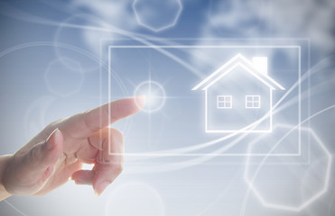 Hand clicking on house symbol