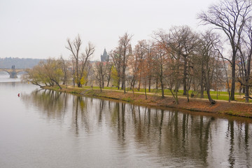 Fototapeta na wymiar Panorama of an old Prague, bridges and embankment of Vitava river, Czechia